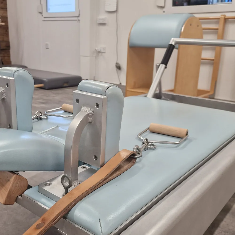 A classical Reformer footbar and straps at Pilates From Within